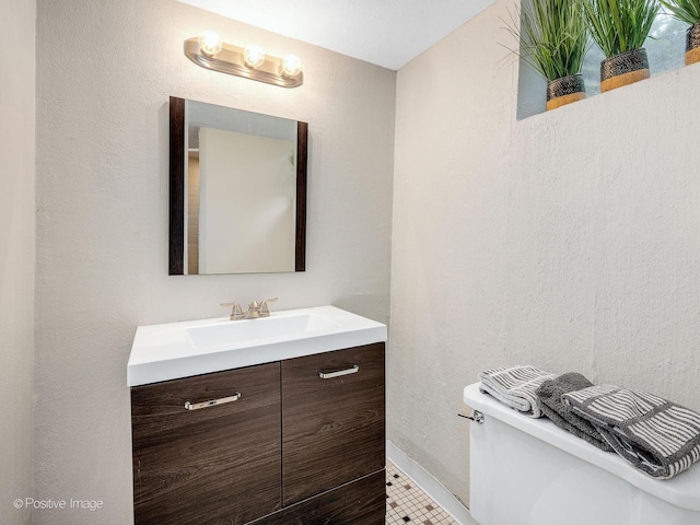 407 Turner Ave, Glen Ellyn, IL 60137 - half bathroom featuring vanity, toilet, and baseboards
