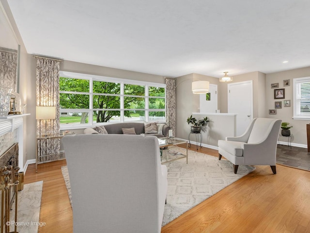 407 Turner Ave, Glen Ellyn, IL 60137 - living room featuring baseboards, a fireplace, and wood finished floors