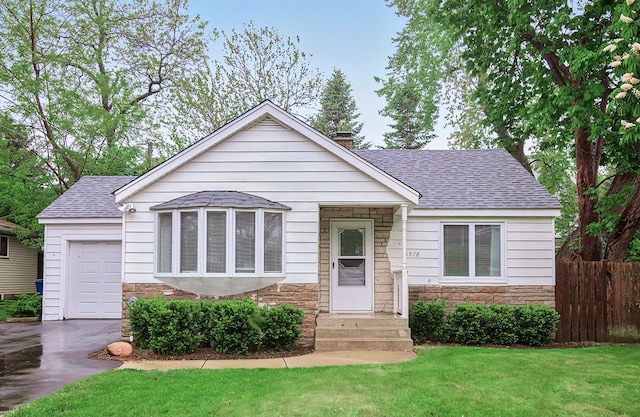 33978 N Lake Rd, Grayslake, IL 60030 - view of front of home featuring stone siding, roof with shingles, and an attached garage