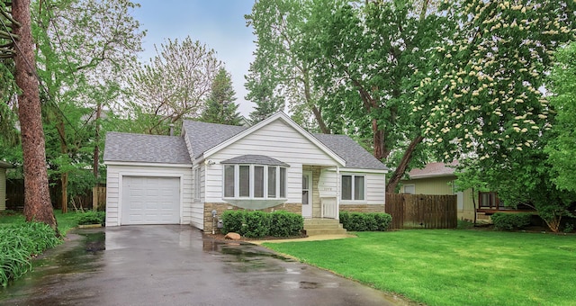 33978 N Lake Rd, Grayslake, IL 60030 - view of front of home with asphalt driveway, roof with shingles, stone siding, and an attached garage