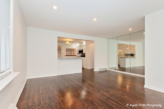 33978 N Lake Rd, Grayslake, IL 60030 - unfurnished living room with dark wood finished floors, baseboards, and recessed lighting