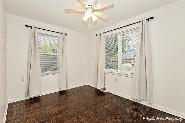 33978 N Lake Rd, Grayslake, IL 60030 - spare room with healthy amount of natural light, ceiling fan, dark wood-style floors, and baseboards