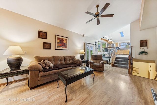 841 Bonnie Brae Ln, Bolingbrook, IL 60440 - living room featuring high vaulted ceiling, a ceiling fan, light wood-style flooring, and stairs