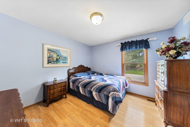 841 Bonnie Brae Ln, Bolingbrook, IL 60440 - bedroom featuring light wood finished floors and baseboards