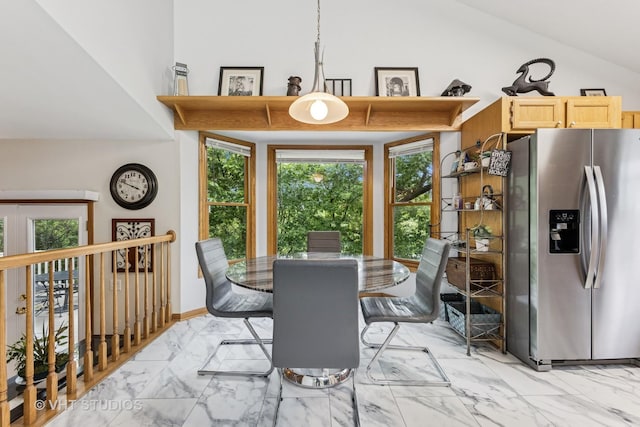 841 Bonnie Brae Ln, Bolingbrook, IL 60440 - dining room with light marble finish flooring and lofted ceiling