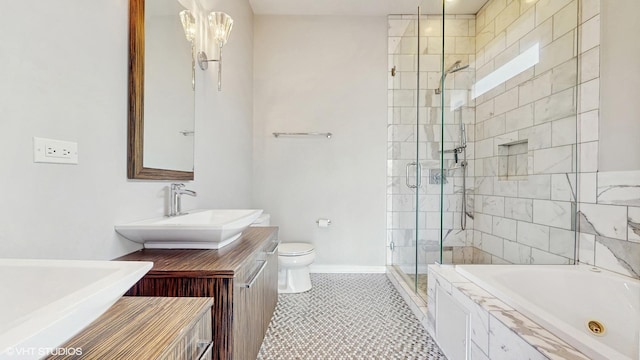 2712 N Artesian Ave Unit 3, Chicago, IL 60647 - bathroom featuring a shower stall, toilet, a jetted tub, vanity, and baseboards