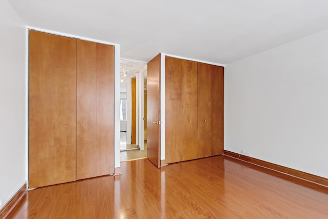 535 N Michigan Ave Unit 1009, Chicago, IL 60611 - unfurnished bedroom with wood finished floors