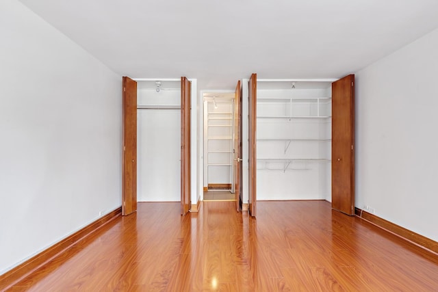 535 N Michigan Ave Unit 1009, Chicago, IL 60611 - unfurnished bedroom with light wood finished floors and baseboards