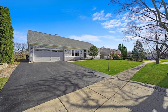 975 Patriot Ln, Hoffman Estates, IL 60192 - view of front of house with asphalt driveway, a garage, a front yard, and roof with shingles