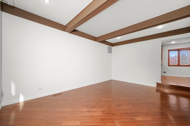 975 Patriot Ln, Hoffman Estates, IL 60192 - unfurnished living room with wood finished floors, beam ceiling, recessed lighting, and baseboards