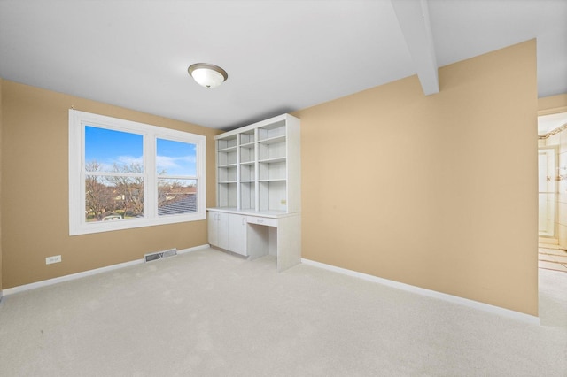 975 Patriot Ln, Hoffman Estates, IL 60192 - unfurnished bedroom featuring light carpet, baseboards, and beam ceiling