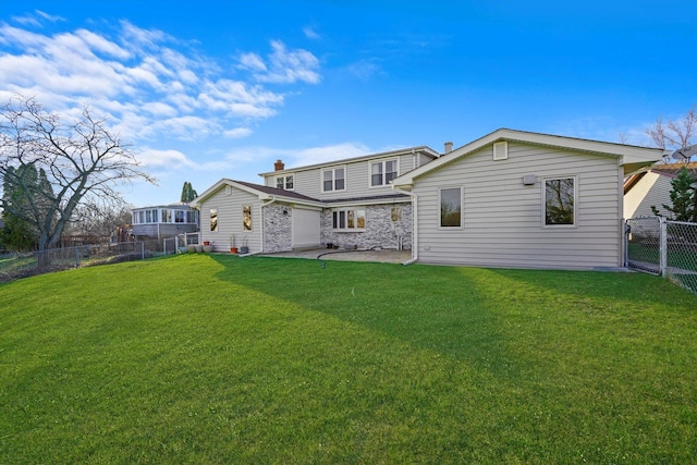 975 Patriot Ln, Hoffman Estates, IL 60192 - back of property with a patio and stone siding