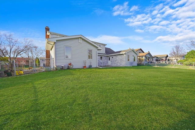 975 Patriot Ln, Hoffman Estates, IL 60192 - rear view of property with a chimney and stone siding