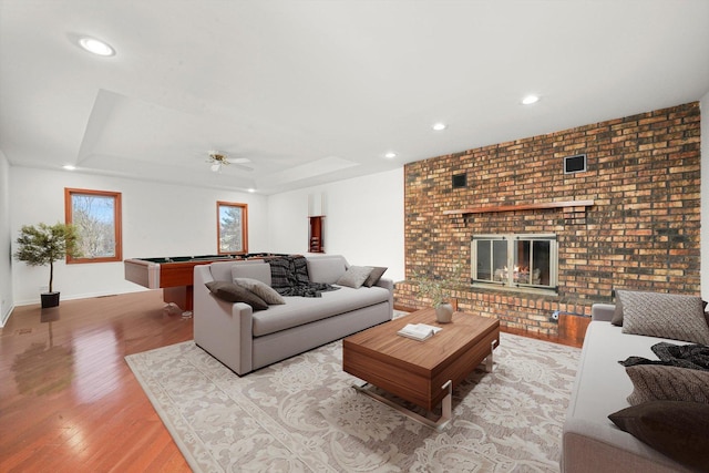 975 Patriot Ln, Hoffman Estates, IL 60192 - living area with wood finished floors, a brick fireplace, pool table, a ceiling fan, and baseboards