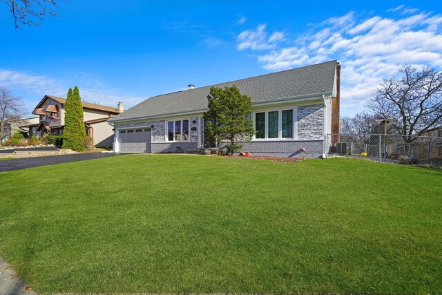 975 Patriot Ln, Hoffman Estates, IL 60192 - view of front of home featuring a garage, asphalt driveway, brick siding, and a shingled roof