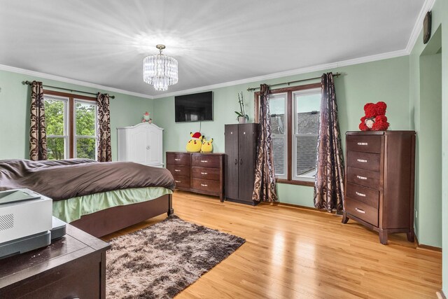 2015 Busse Hwy, Des Plaines, IL 60016 - bedroom featuring wood finished floors, a chandelier, and crown molding