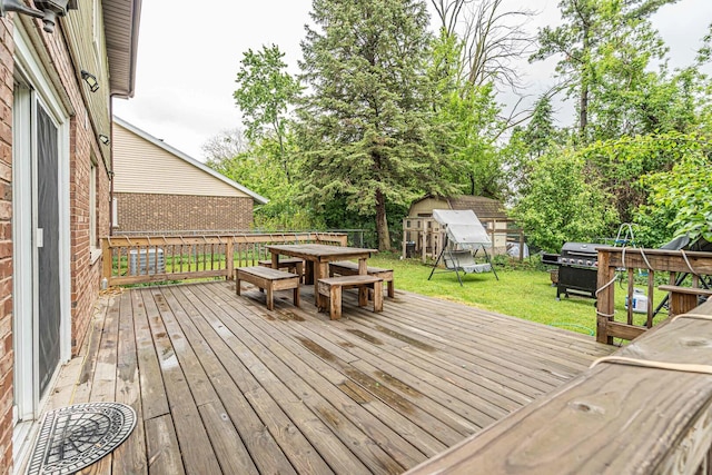 2015 Busse Hwy, Des Plaines, IL 60016 - deck with outdoor dining area, a yard, and area for grilling
