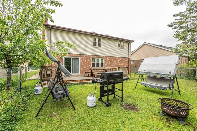 2015 Busse Hwy, Des Plaines, IL 60016 - back of house with an outdoor fire pit and brick siding