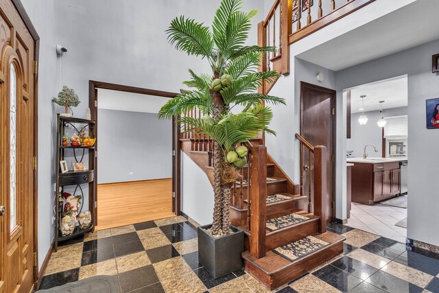 2015 Busse Hwy, Des Plaines, IL 60016 - entryway featuring stairway, granite tiled floors, and baseboards