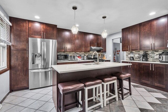 2015 Busse Hwy, Des Plaines, IL 60016 - kitchen with stainless steel appliances, tasteful backsplash, light countertops, under cabinet range hood, and recessed lighting