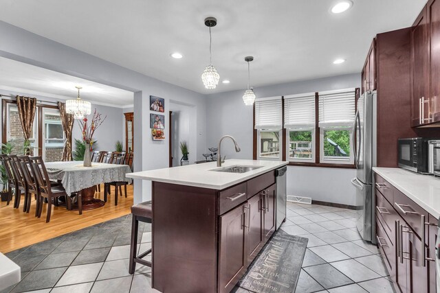 2015 Busse Hwy, Des Plaines, IL 60016 - kitchen featuring stainless steel appliances, a chandelier, a sink, light tile patterned floors, and recessed lighting