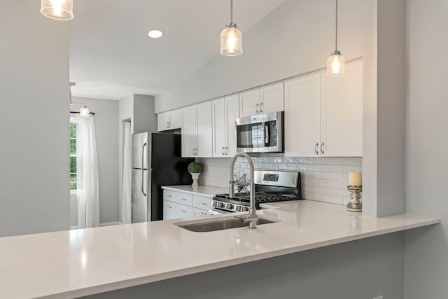 1802 77th St, Naperville, IL 60565 - kitchen featuring appliances with stainless steel finishes, backsplash, pendant lighting, and white cabinetry