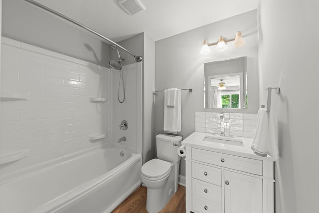 1802 77th St, Naperville, IL 60565 - bathroom featuring toilet, vanity, washtub / shower combination, wood finished floors, and a ceiling fan