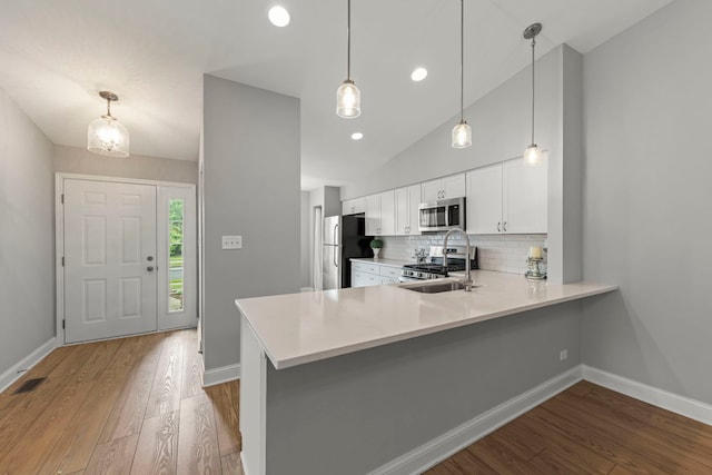 1802 77th St, Naperville, IL 60565 - kitchen featuring appliances with stainless steel finishes, light wood-style flooring, baseboards, light countertops, and recessed lighting