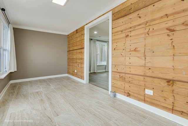 2413 20th St, North Chicago, IL 60064 - spare room featuring crown molding, baseboards, and wooden walls