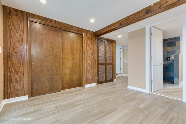 2413 20th St, North Chicago, IL 60064 - unfurnished bedroom with light wood finished floors, a closet, recessed lighting, beamed ceiling, and baseboards