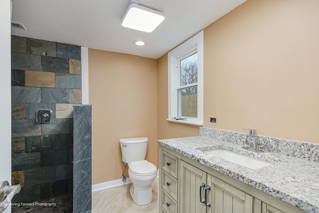 2413 20th St, North Chicago, IL 60064 - full bathroom with vanity, a walk in shower, toilet, and baseboards