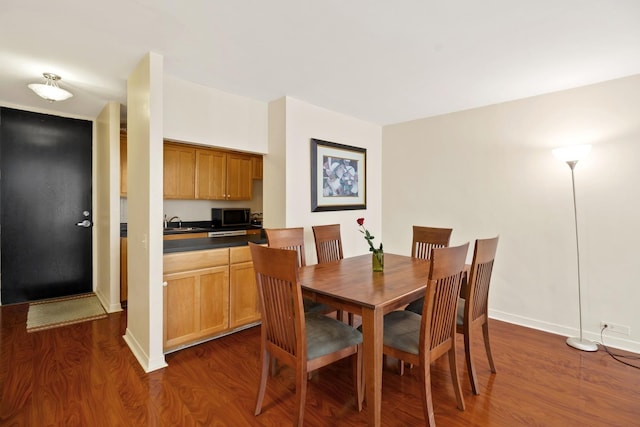 535 N Michigan Ave Unit 1205, Chicago, IL 60611 - dining space with dark wood finished floors and baseboards