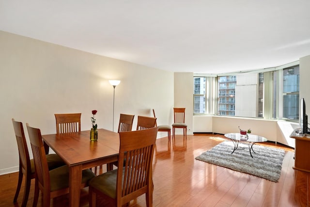 535 N Michigan Ave Unit 1205, Chicago, IL 60611 - dining space featuring wood finished floors and baseboards