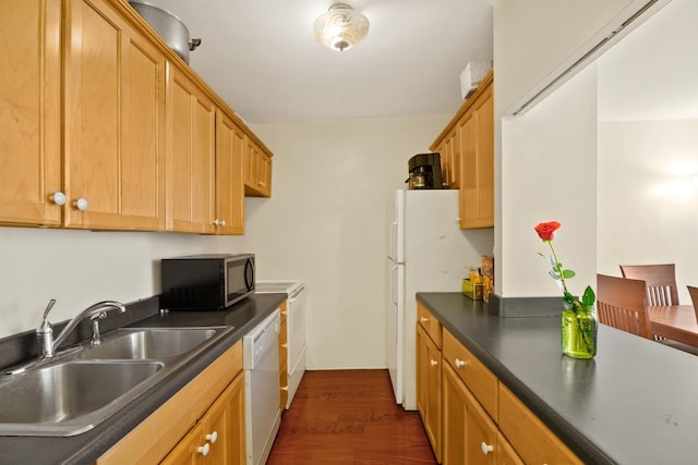535 N Michigan Ave Unit 1205, Chicago, IL 60611 - kitchen featuring white appliances, a sink, dark countertops, and dark wood-type flooring