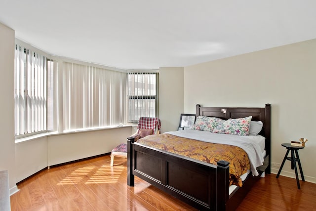 535 N Michigan Ave Unit 1205, Chicago, IL 60611 - bedroom featuring baseboards and light wood-type flooring