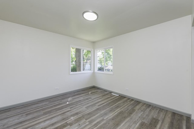 1525 Grove Dr, Round Lake Beach, IL 60073 - unfurnished room featuring wood finished floors and baseboards