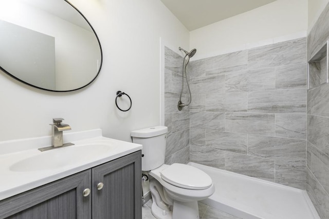 1525 Grove Dr, Round Lake Beach, IL 60073 - full bathroom featuring vanity, toilet, and a tile shower