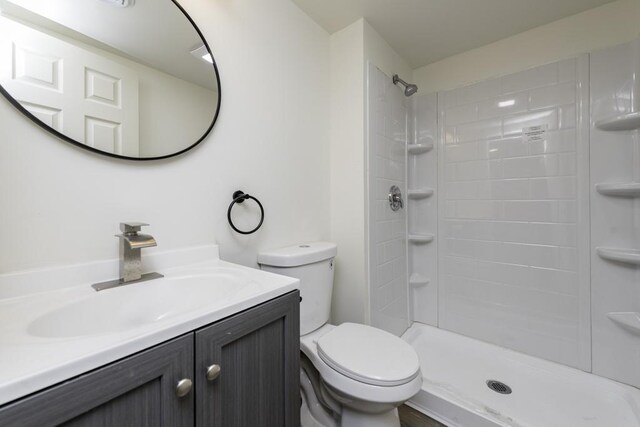 1525 Grove Dr, Round Lake Beach, IL 60073 - full bathroom featuring toilet, vanity, and a shower