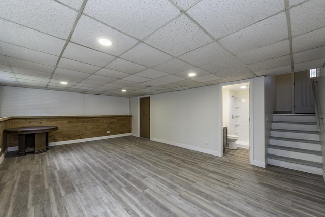 1525 Grove Dr, Round Lake Beach, IL 60073 - finished basement with baseboards, wood finished floors, stairs, a drop ceiling, and recessed lighting