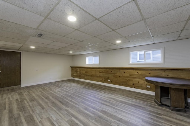 1525 Grove Dr, Round Lake Beach, IL 60073 - below grade area featuring baseboards, wood finished floors, a paneled ceiling, recessed lighting, and wood walls
