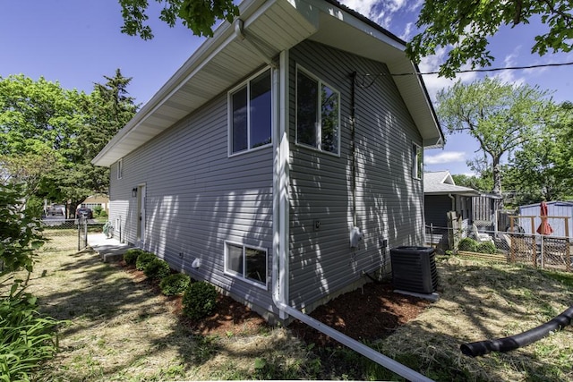 1525 Grove Dr, Round Lake Beach, IL 60073 - view of property exterior with central air condition unit