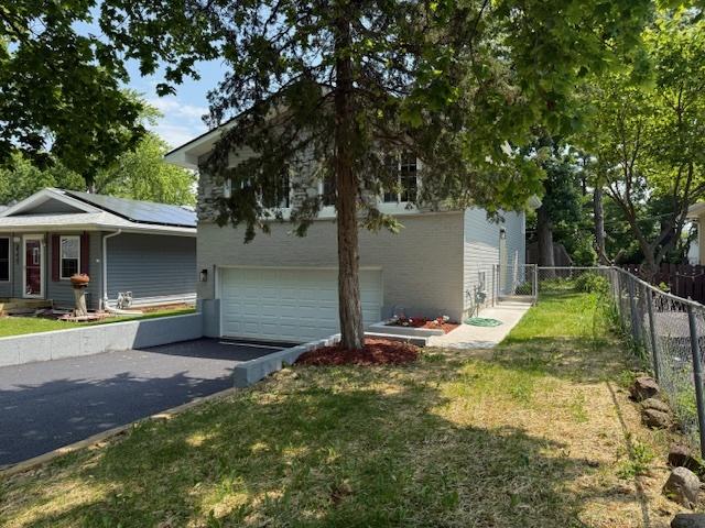 1525 Grove Dr, Round Lake Beach, IL 60073 - view of yard featuring a shed