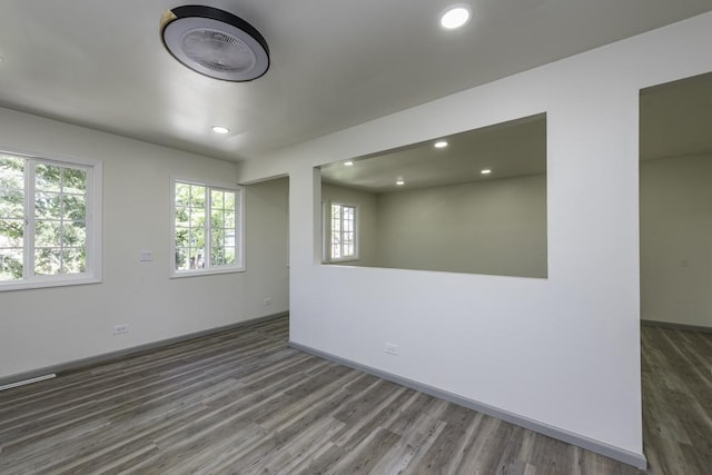 1525 Grove Dr, Round Lake Beach, IL 60073 - spare room with wood finished floors, plenty of natural light, recessed lighting, and baseboards