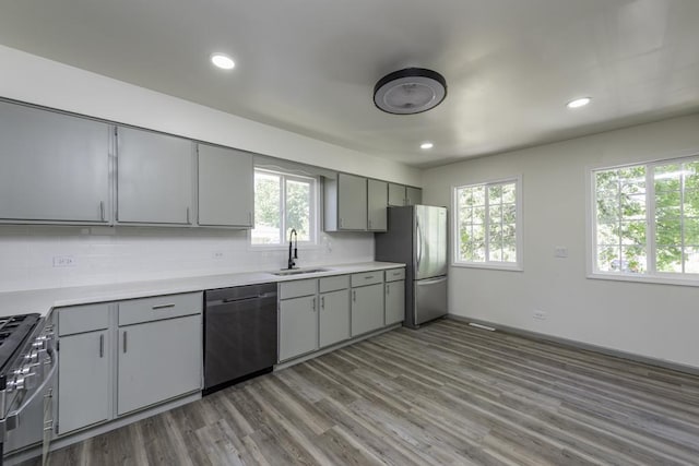 1525 Grove Dr, Round Lake Beach, IL 60073 - kitchen featuring stainless steel appliances, a sink, gray cabinets, plenty of natural light, and recessed lighting