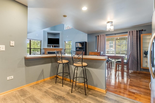 18225 Eagle Dr, Tinley Park, IL 60477 - kitchen featuring wood finished floors, baseboards, healthy amount of natural light, vaulted ceiling, and recessed lighting
