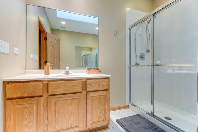 18225 Eagle Dr, Tinley Park, IL 60477 - bathroom with a skylight, tile patterned floors, a shower stall, and vanity