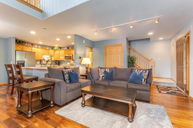 18225 Eagle Dr, Tinley Park, IL 60477 - living room featuring light wood finished floors, stairs, baseboards, rail lighting, and recessed lighting