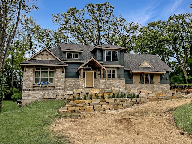 3515 Kings Lair Dr, Spring Grove, IL 60081 - view of front facade featuring stone siding, a front yard, and roof with shingles