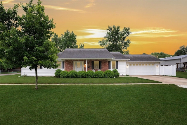 956 E Orleans St, Paxton, IL 60957 - ranch-style house with driveway, a garage, and brick siding