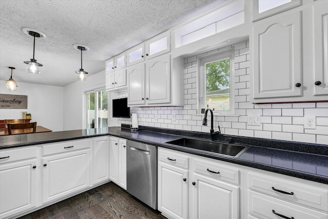956 E Orleans St, Paxton, IL 60957 - kitchen with dishwasher, a sink, dark wood finished floors, white cabinetry, and dark countertops